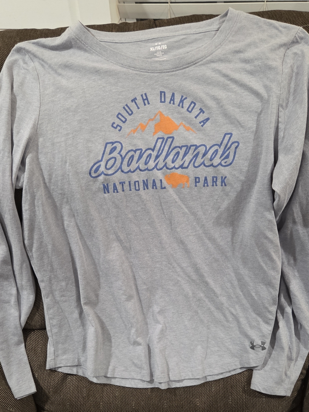 Under Armour Light Gray Long Sleeve Tee with Blue and Orange Badlands Graphic